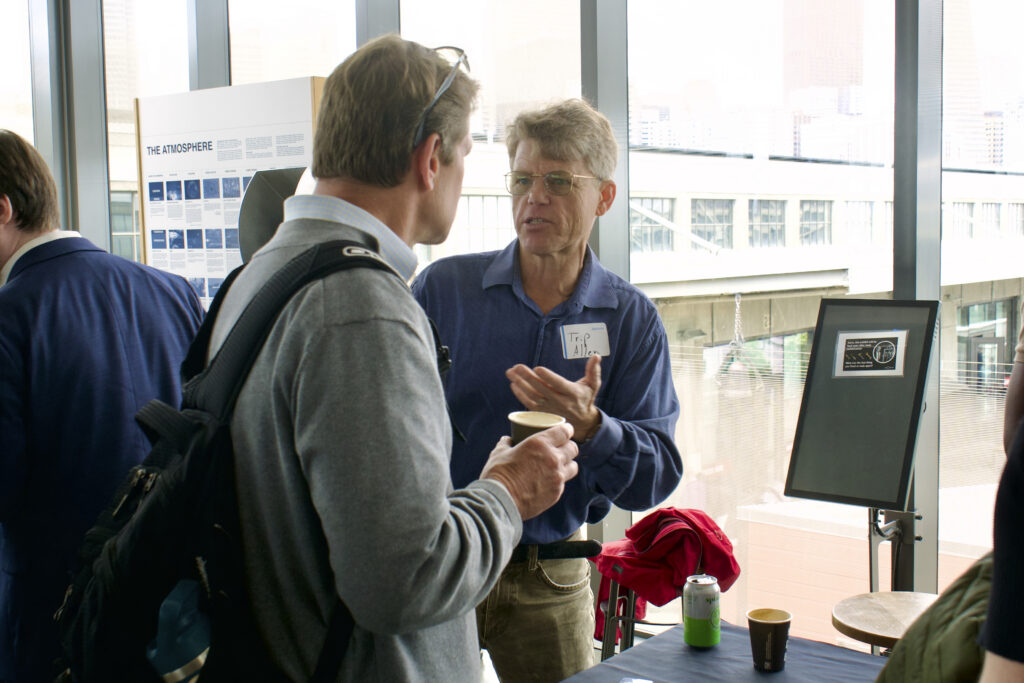 Terranova Executive Chairman CEO Trip Allen stands talking to an attendee.